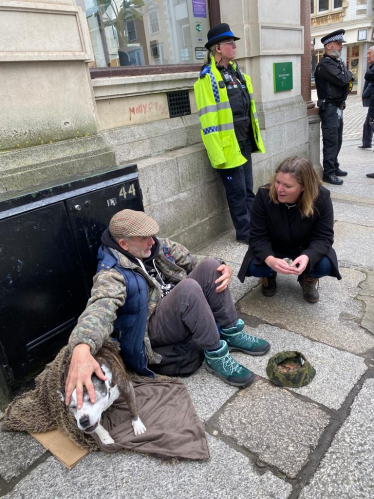 Cherilyn Mackrory MP speaking with local homeless man in Truro